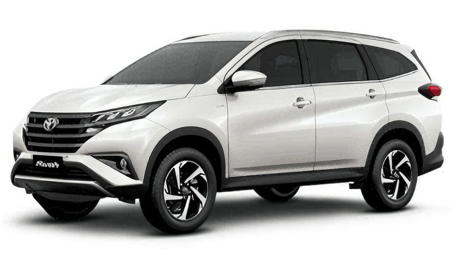 Toyota Rush warna putih difoto dari sudut depan samping, menampilkan desain SUV tangguh dengan grille depan hitam berlapis krom, headlamp LED modern, body cladding hitam di sekeliling bodi untuk kesan gagah, serta ground clearance tinggi khas SUV. Sebagai armada sewa mobil di Medan, Rush menjadi pilihan SUV 7 penumpang yang cocok untuk keluarga maupun perjalanan ke luar kota dengan medan menanjak/tidak rata seperti menuju Berastagi dan Danau Toba, menggabungkan kapasitas MPV dengan tampilan dan ketangguhan SUV.